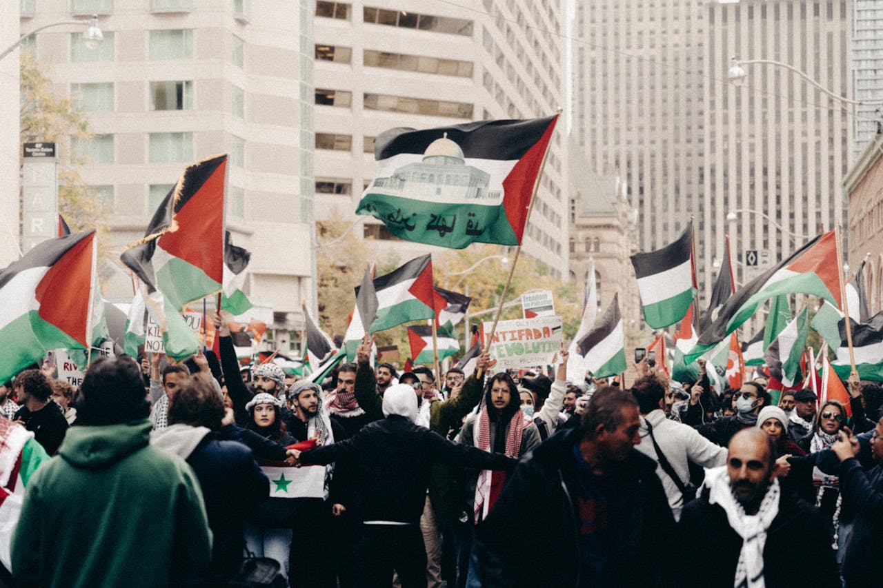 A vibrant street protest with flags and signs, highlighting passion and activism.